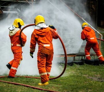 Firefighter concept fireman using water and extinguisher to fighting with fire flame e1714234988431 360x320