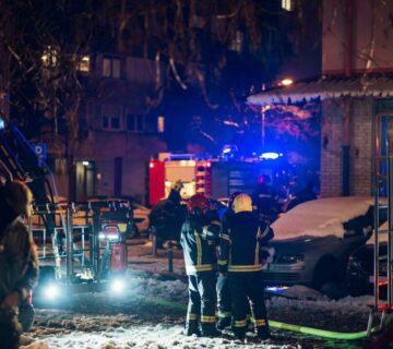 Firemen at work near their truck on the street e1714846742589 360x320